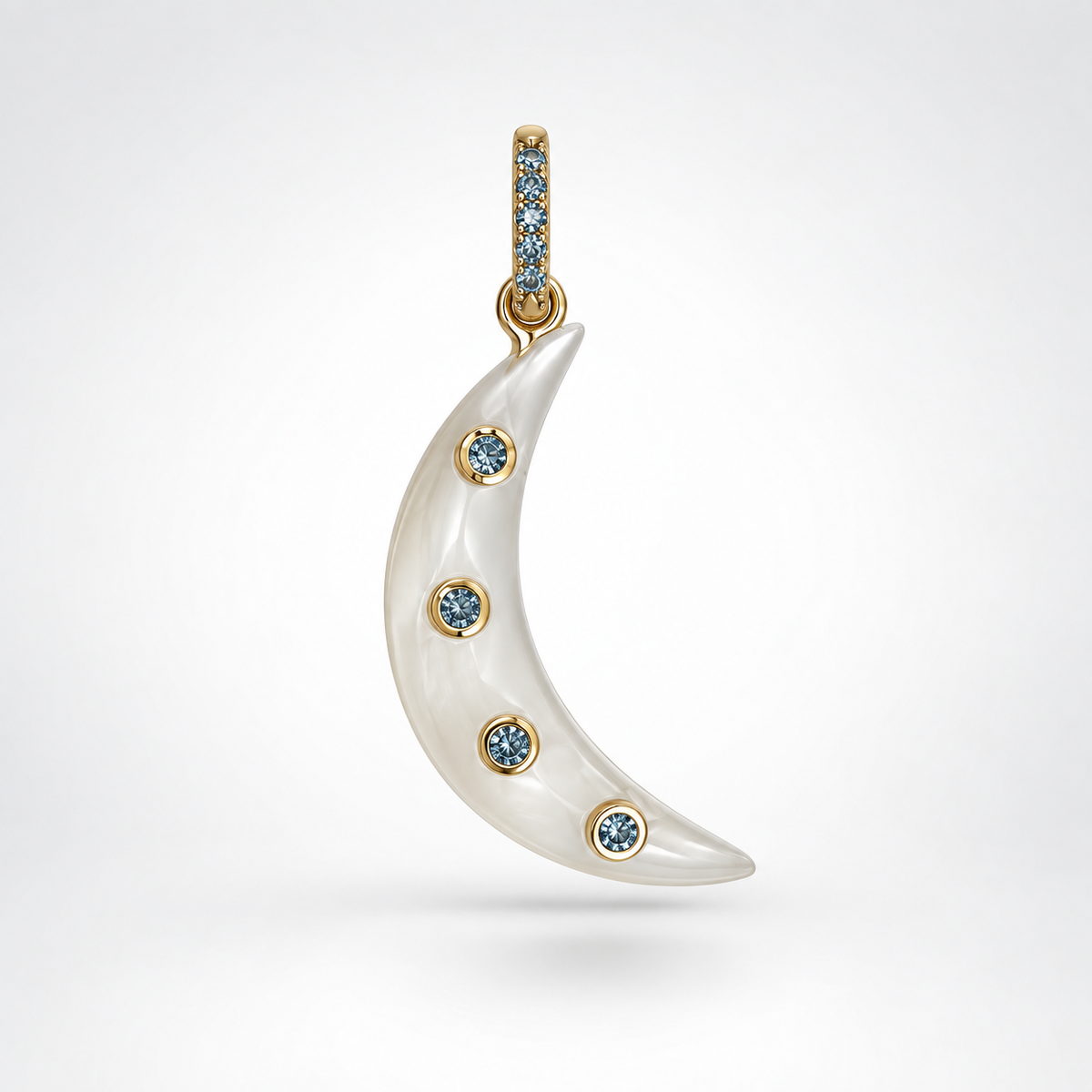 Moonstone crescent moon pendant with four bezel-set London blue topaz stones on the moon and blue topaz accents along the 14k gold bail, shown against a white background.