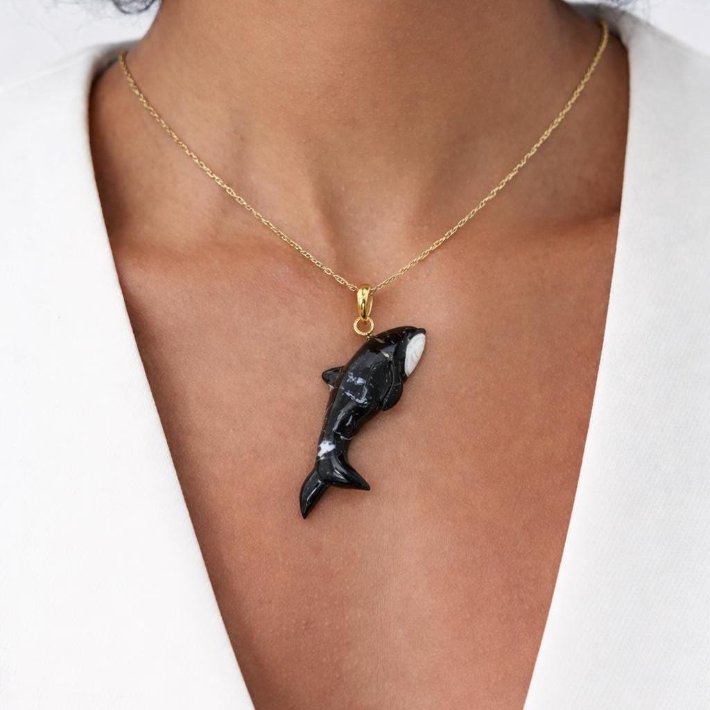 Model Wearing Fossilized Shell Orca Pendant – Hand Carved Glossy Black Killer Whale Gold Chain Necklace
