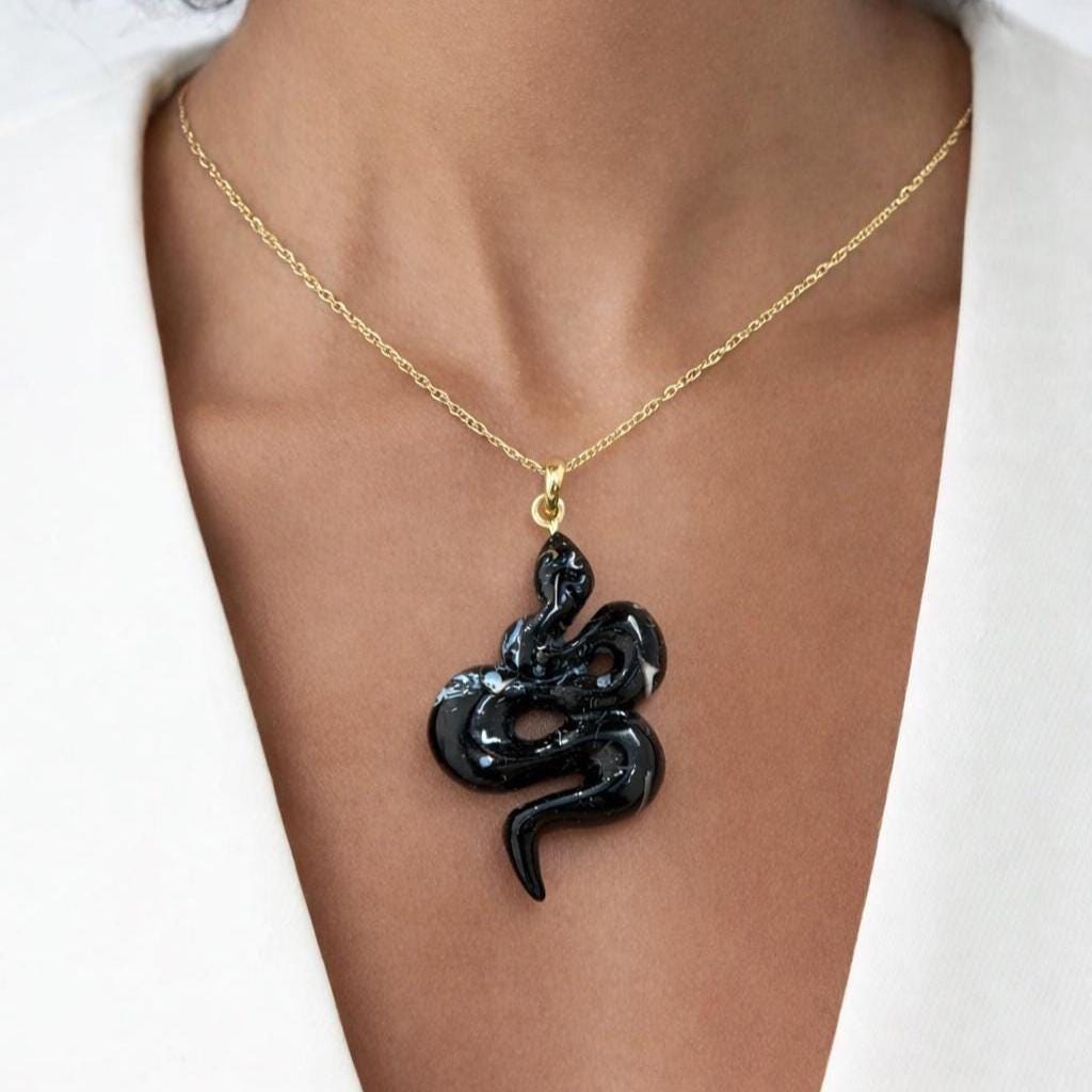 Model Wearing Fossilized Shell Serpent Pendant – Glossy Black Coiled Snake Fossil Gemstone Gold Necklace
