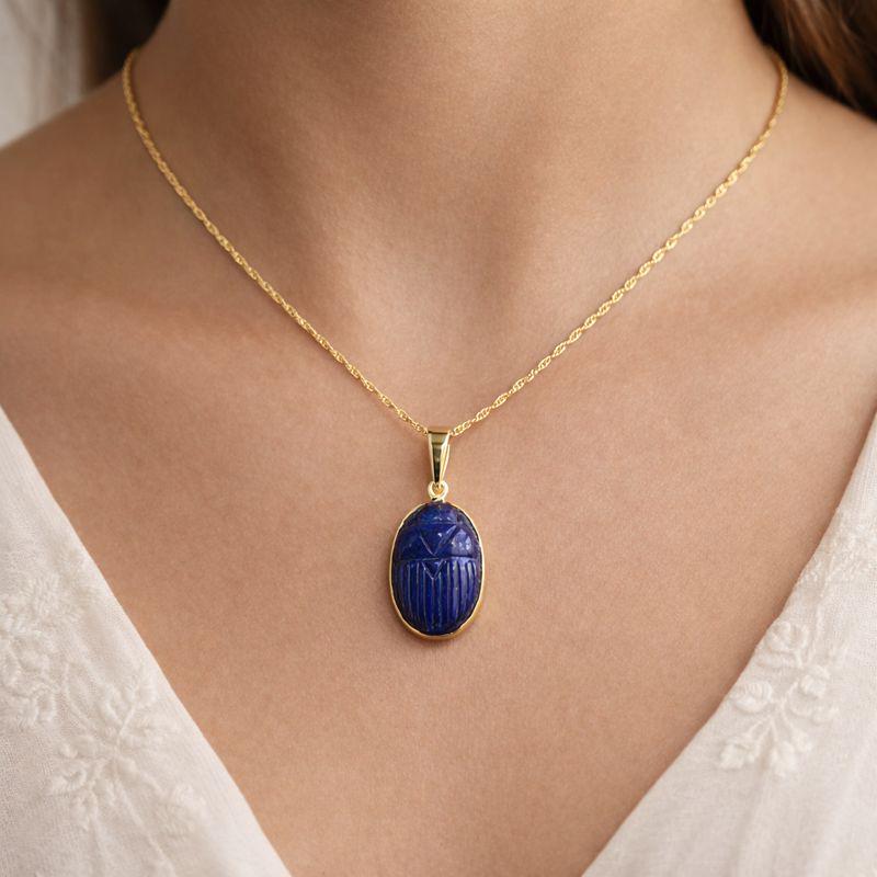 Model Wearing Lapis Lazuli Oval Scarab Pendant – Carved Deep Blue Gemstone Egyptian Gold Necklace
