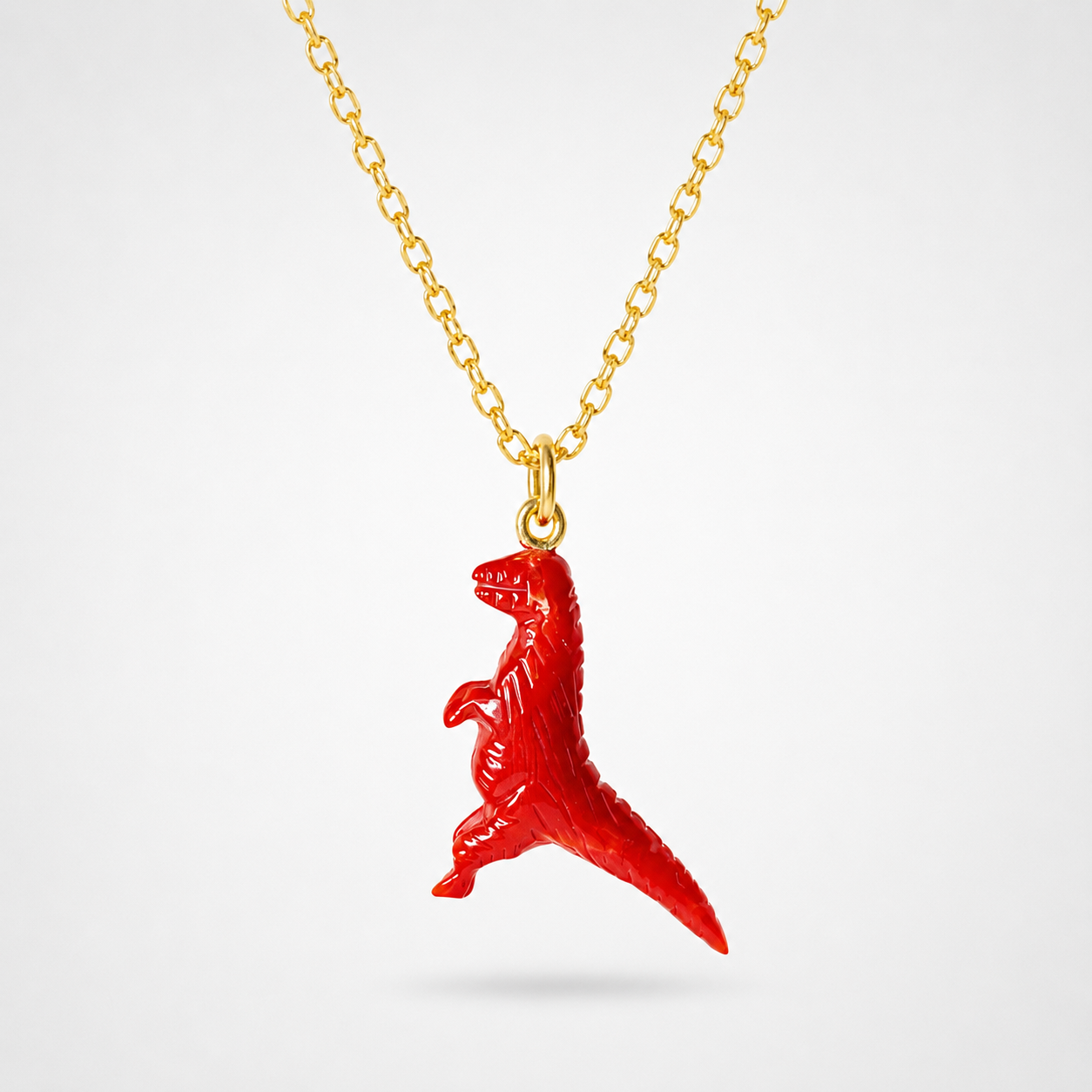 Red Coral Hand Carved T-Rex Dinosaur Pendant on Gold Chain – Vivid Red 3D Gemstone Dino Necklace
