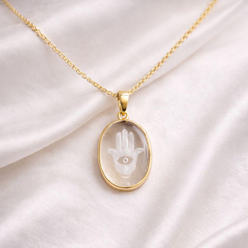 Rock Crystal Hamsa Hand Pendant on White Satin – Carved Clear Quartz Oval Evil Eye Gold Necklace
