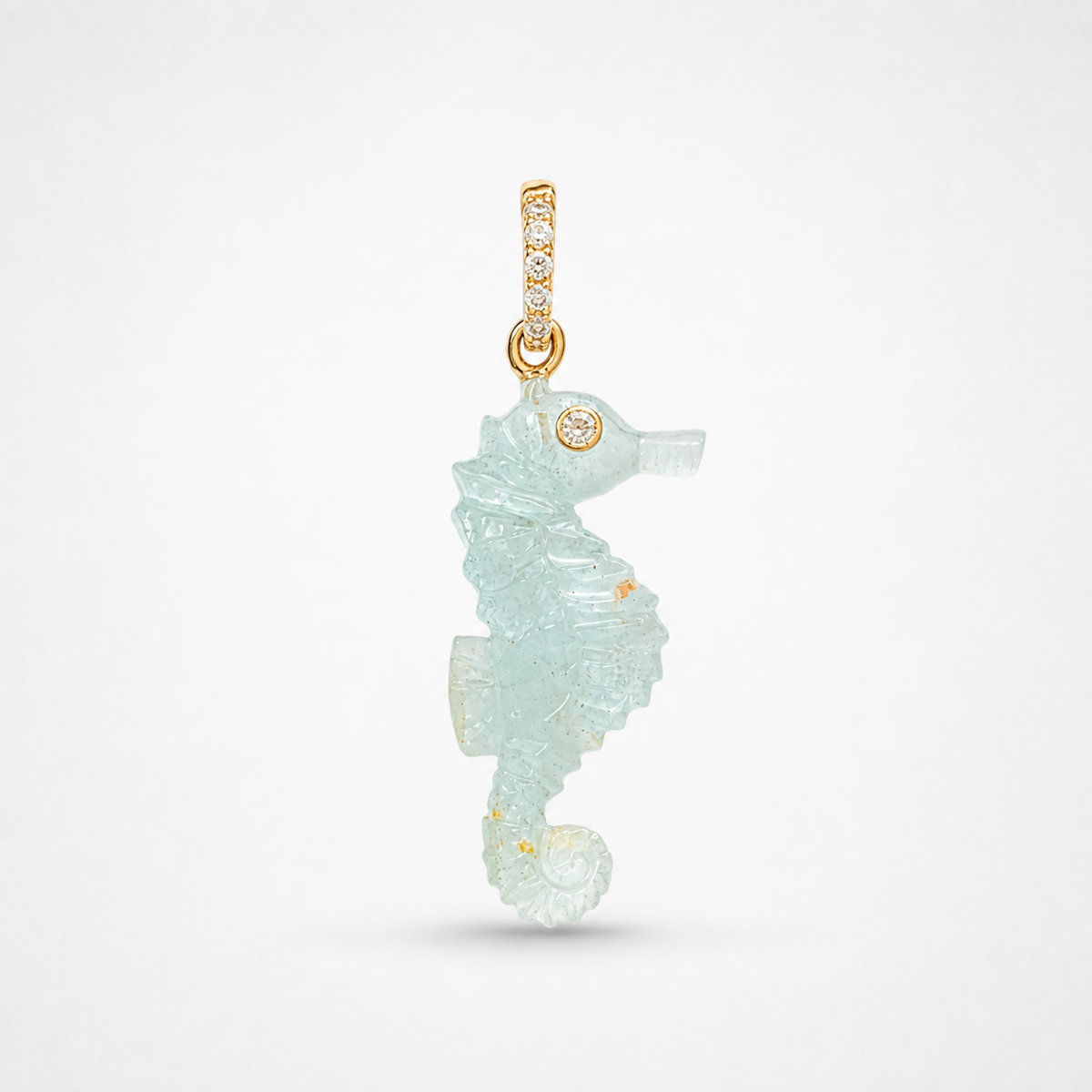 Hand-carved aquamarine seahorse pendant with 14k gold bail set with accent white topaz, pale seafoam gemstone carving with intricate scale detailing